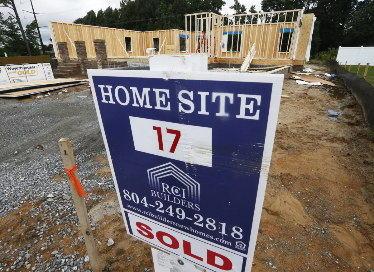 A new home is under construction in Mechanicsville, Va., on June 13, 2019. (AP Photo/Steve Helber)