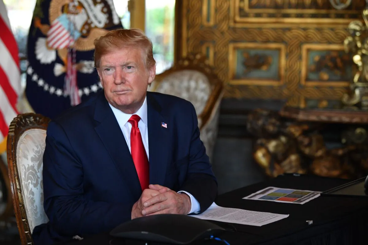 President Donald Trump answers questions from reporters after making a video call to the troops stationed worldwide at the Mar-a-Lago estate in Palm Beach, Fla., on Dec. 24, 2019. (Nicholas Kamm/AFP via Getty Images)