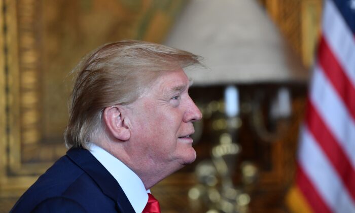 President Donald Trump makes a video call to the troops stationed worldwide to the troops stationed worldwide at the Mar-a-Lago estate in Palm Beach Florida, on Dec. 24, 2019. (Nicholas Kamm/AFP via Getty Images)