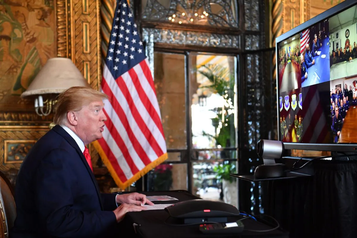 President Donald Trump makes a video call to troops stationed worldwide at the Mar-a-Lago estate in Palm Beach Florida, on Dec. 24, 2019. (Nicholas Kamm/AFP via Getty Images)