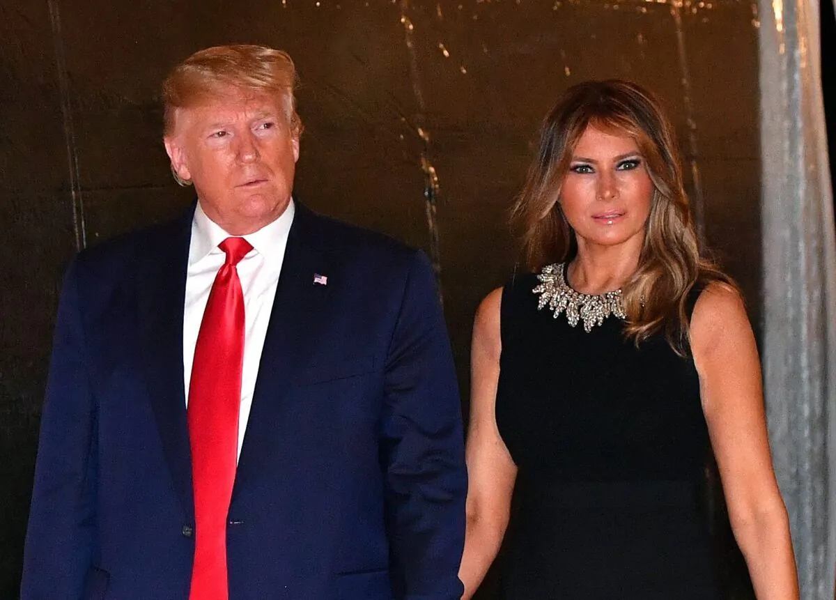 President Donald Trump and First Lady Melania Trump arrive for a Christmas Eve dinner with his family at Mar-A-Lago in Palm Beach, Fla., on Dec. 24, 2019. (Nicholas Kamm/AFP via Getty Images)