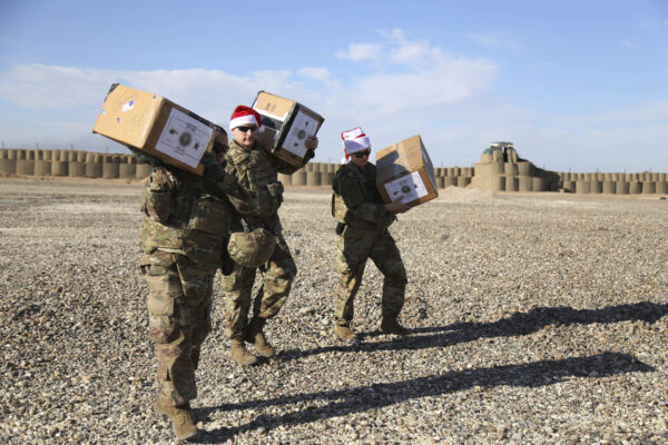 U.S. soldiers deliver Christmas gifts