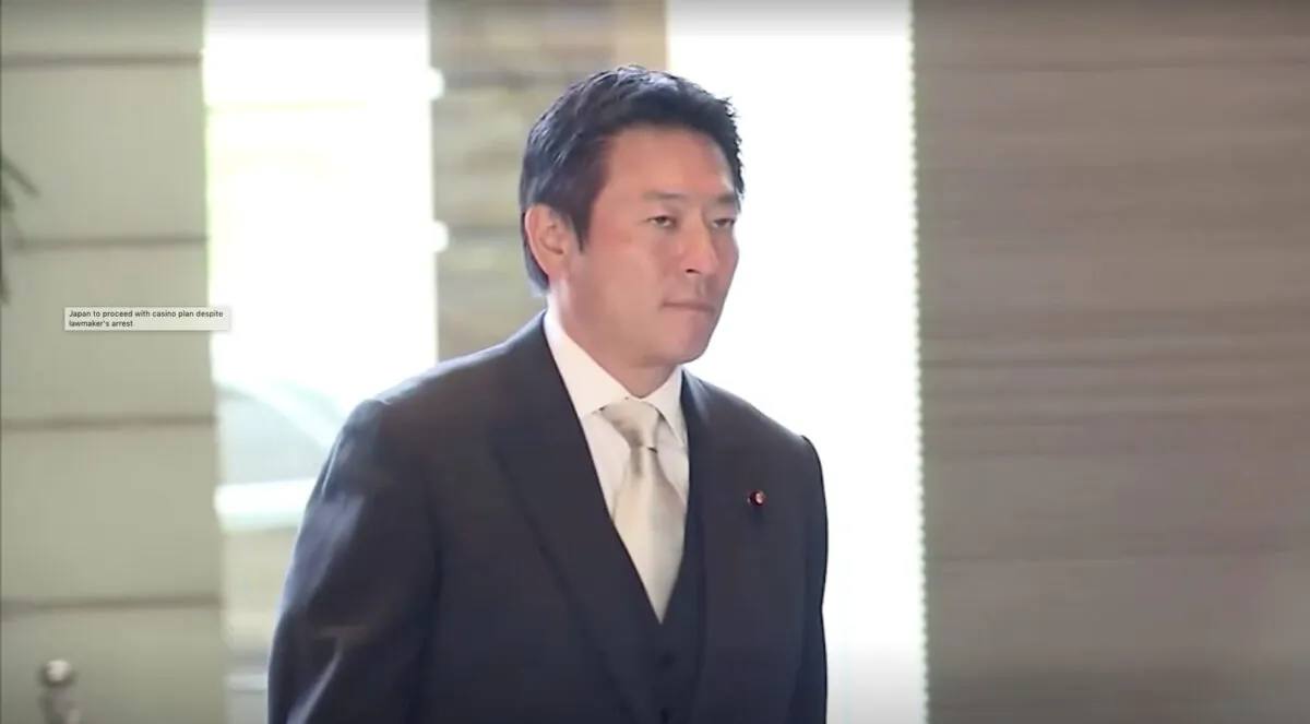 Japanese lawmaker Tsukasa Akimoto walking at entrance of prime minister's office on Dec. 26, 2019. (Screenshot/TV Tokyo via Reuters)