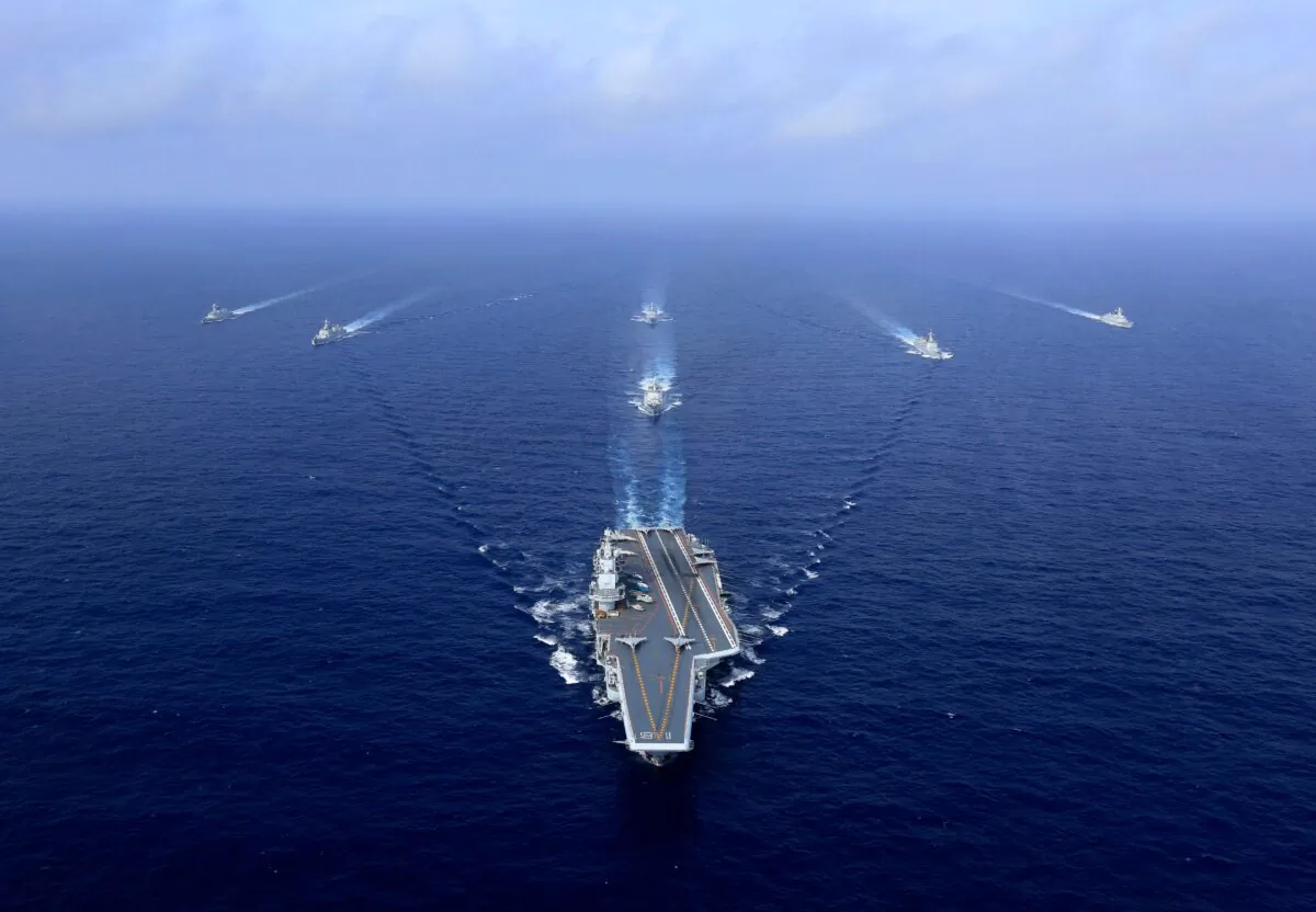 China's sole operational aircraft carrier, the Liaoning (C), sailing during a drill at sea on April 18, 2018. (AFP via Getty Images)