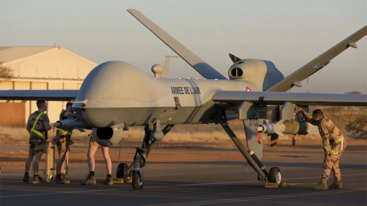 French soldiers loading a French Reaper drone with two GBU 12 missiles on Niamey airbase, Niger on Dec. 17. (French Defense Ministry communication center/AP)