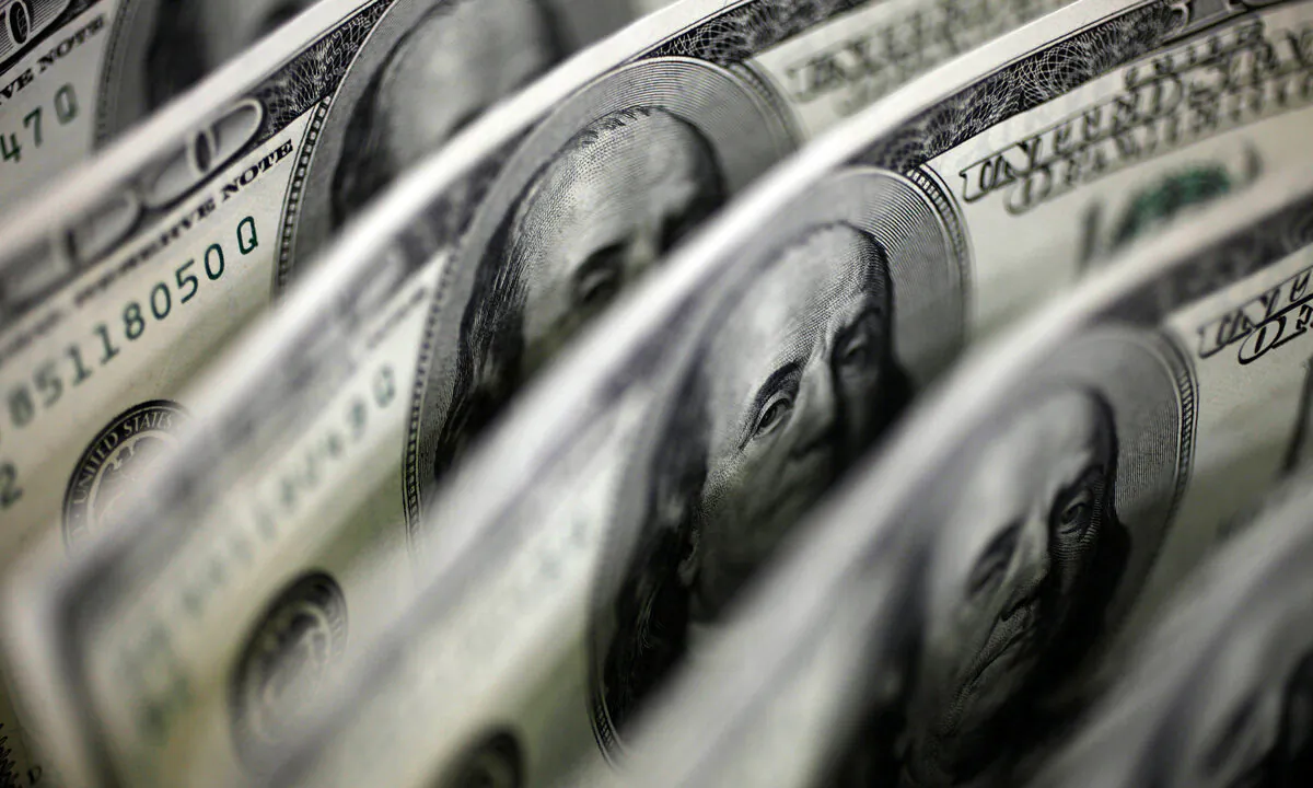 A picture illustration shows U.S. 100 dollar bank notes taken in Tokyo, Japan on Aug. 2, 2011. (Yuriko Nakao/Reuters)