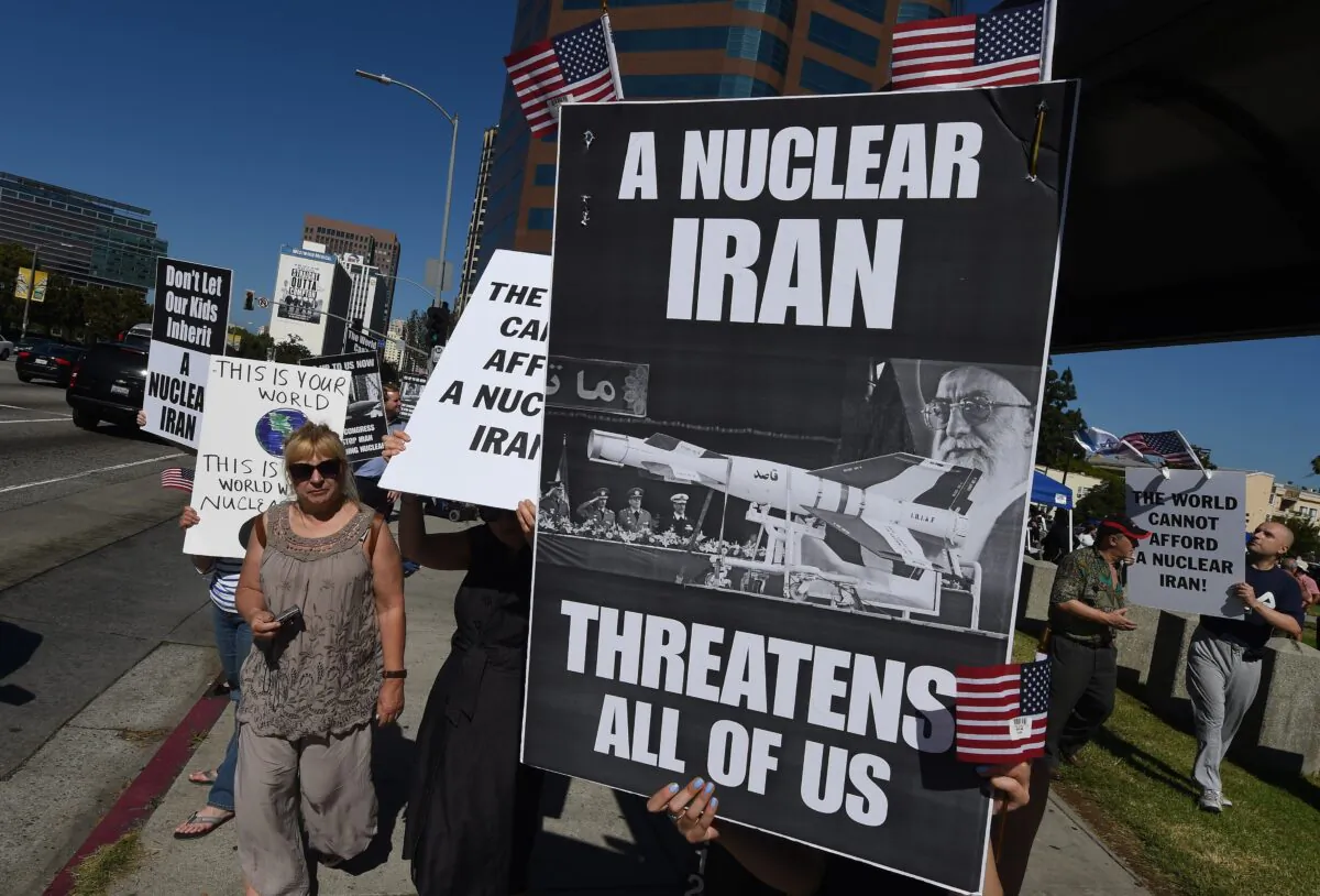 Members of the 'Stand With Us' group hold a rally calling for the rejection of the proposed Iran nuclear deal outside the Federal Building in Los Angeles, U.S. on July 26, 2015.  (Mark Ralston/AFP via Getty Images)