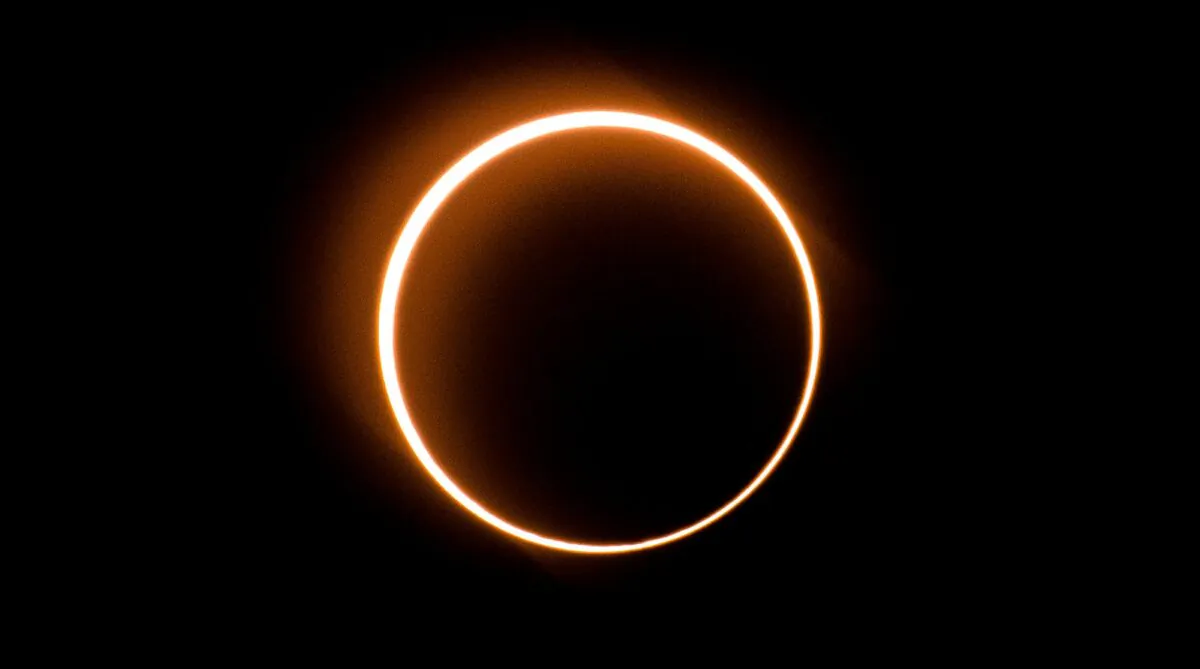 The moon moves in front of the sun in a rare "ring of fire" solar eclipse as seen from Tanjung Piai, Malaysia, on Dec. 26, 2019. (Sadiq Asyraf/AFP via Getty Images)