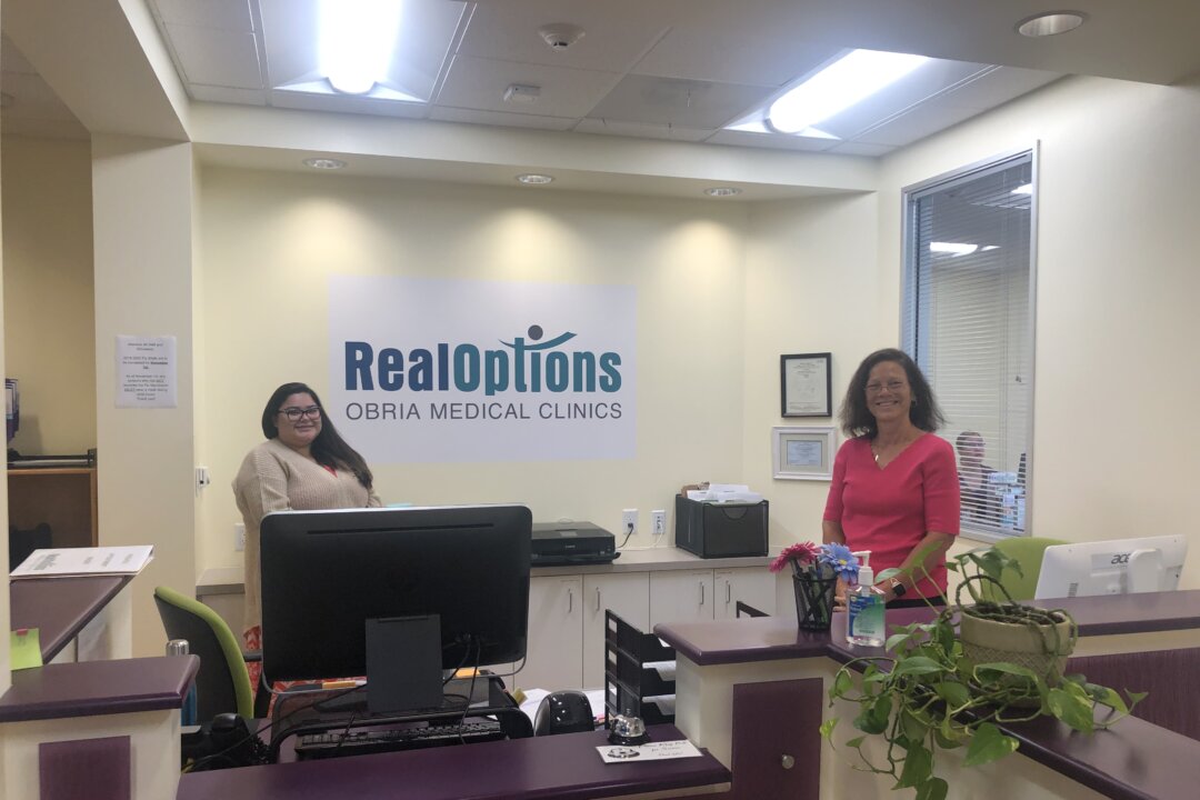 Staff members at RealOptions in Central San Jose. (Nathan Su/The Epoch Times)