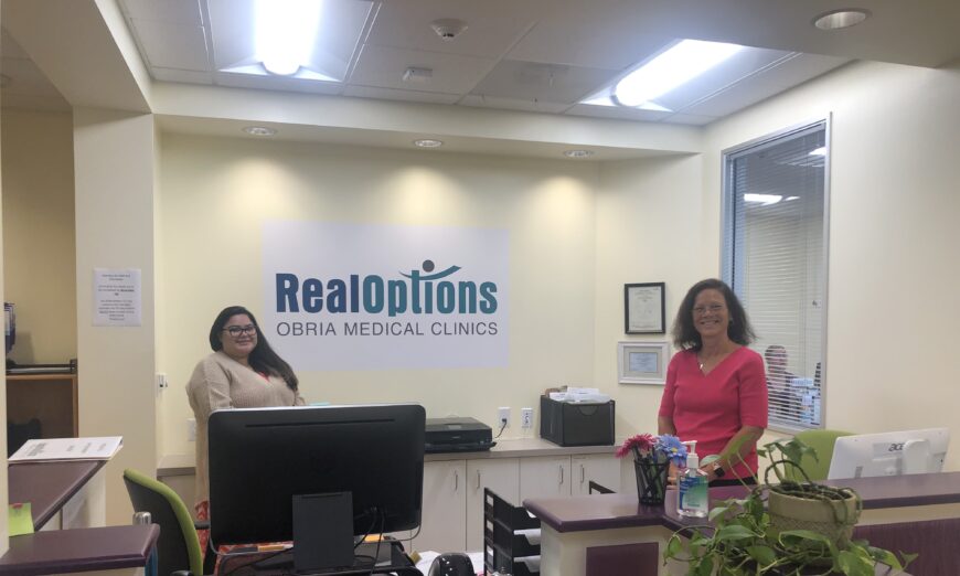 Staff members at RealOptions in Central San Jose. (Nathan Su/The Epoch Times)