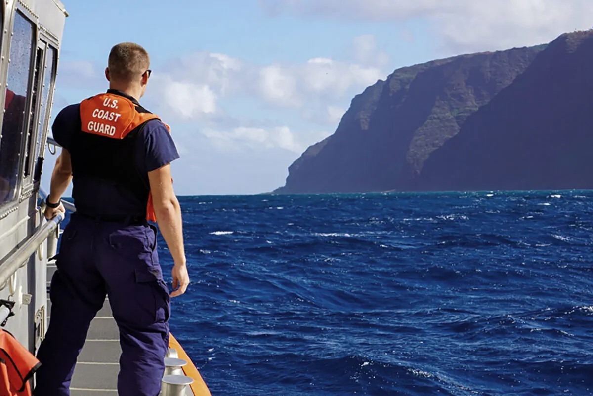 Coast Guard Cutter William Hart moves toward the Na Pali Coast on the Hawaiian island of Kauai on Dec. 27, 2019, the day after a tour helicopter disappeared with seven people aboard. (MK3 Forest Herring/U.S. Coast Guard via AP)