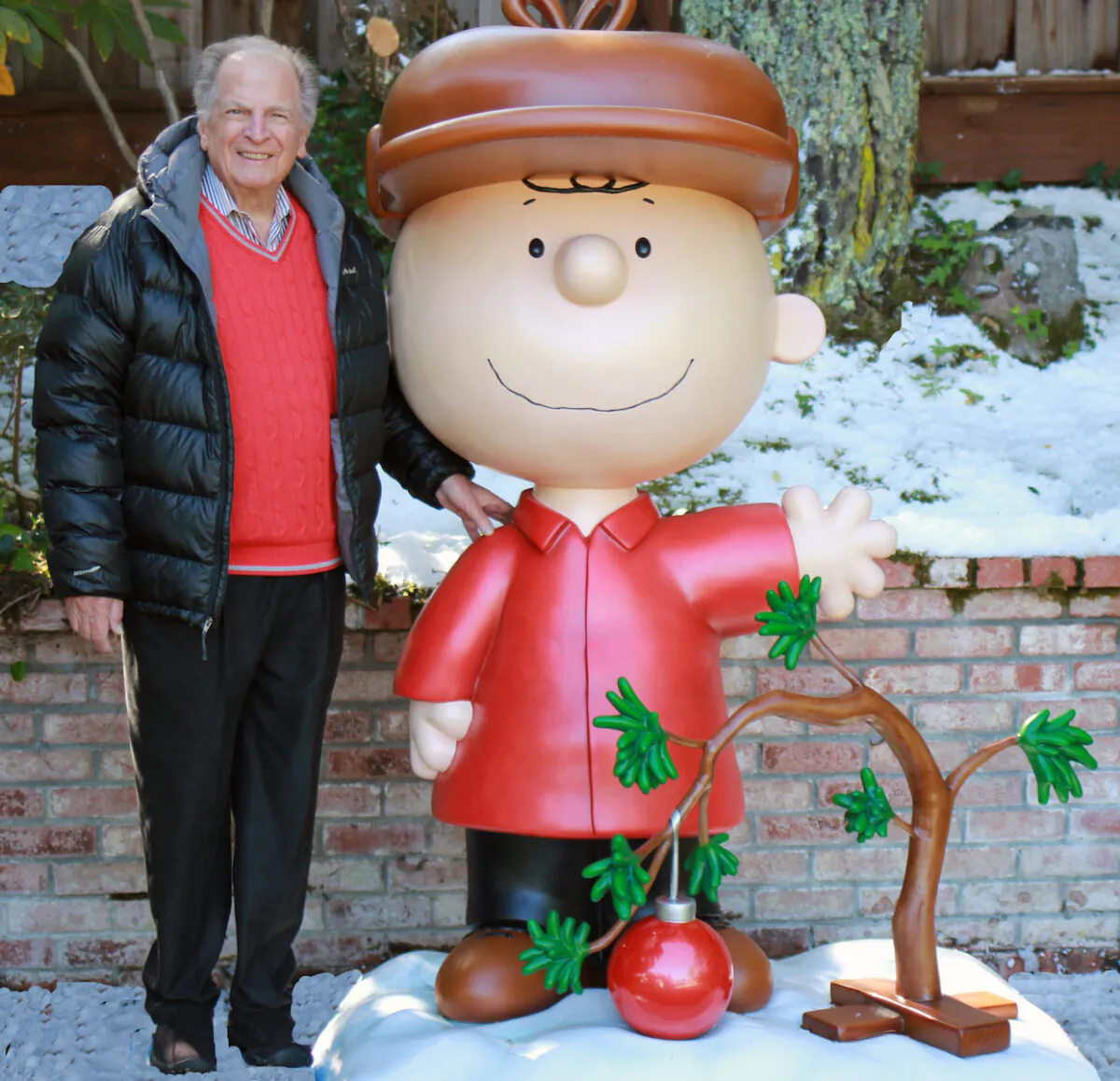 This 2015 photo provided by Jason Mendelson shows Lee Mendelson in Hillsborough, Calif. Lee Mendelson, the producer who changed the face of the holidays when he brought “A Charlie Brown Christmas” to television in 1965 and wrote the lyrics to its signature song, “Christmas Time Is Here,” died on Christmas day, Dec. 25, 2019. (Jason Mendelson via AP)