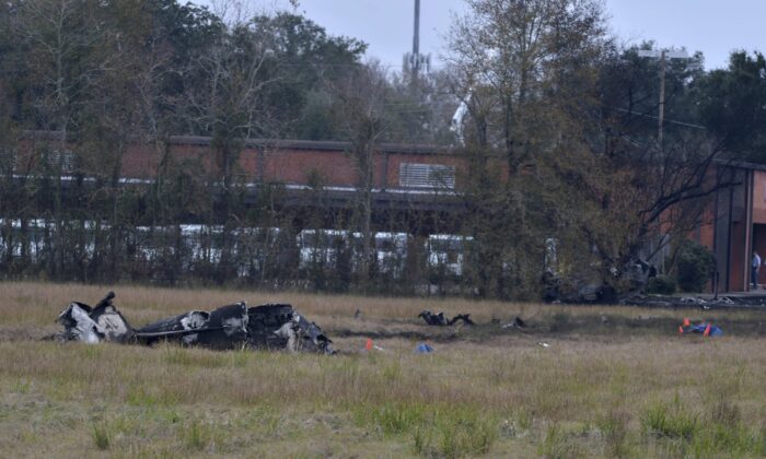 A view of the burnt wreckage of a plane crash near Feu Follet Road and Verot School Road in Lafayette, Louisiana, on Dec. 28, 2019. (Scott Clause/The Lafayette Advertiser via AP)