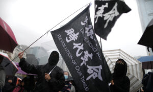 More Than 1,000 Gather for Rain-Soaked Hong Kong Rally
