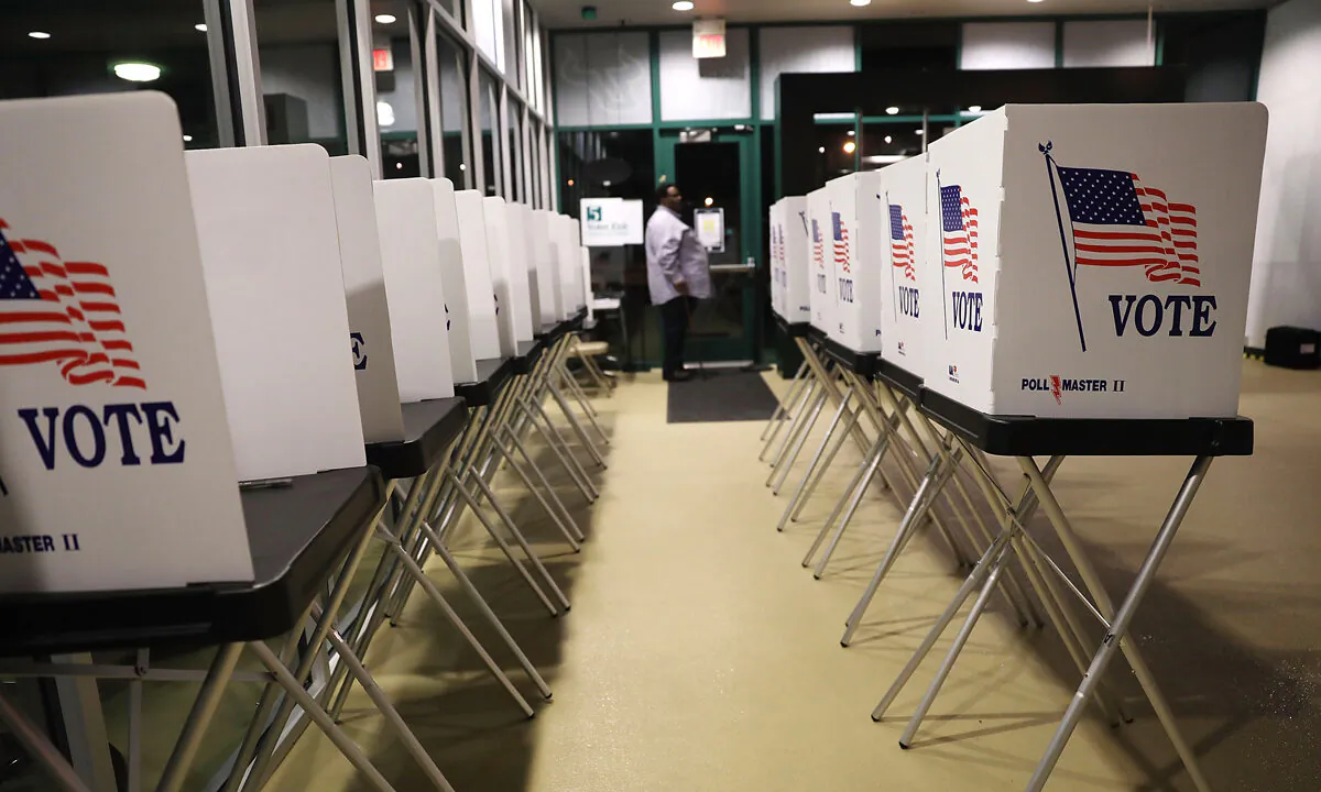 Voting booths are setup at the Yuengling Center on the campus of University of South Florida as workers prepare to open the doors to early voters in Tampa, Fla., on Oct. 22, 2018.  (Joe Raedle/Getty Images)