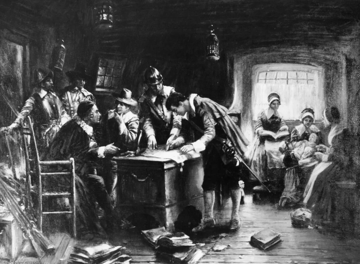 '9th November 1620, Signing the Mayflower Compact' by Edward Percy Moran (1862-1935). Aboard ship the pilgrims are signing an agreement for temporary government of the colony by the will of the majority. (Three Lions/Getty Images)