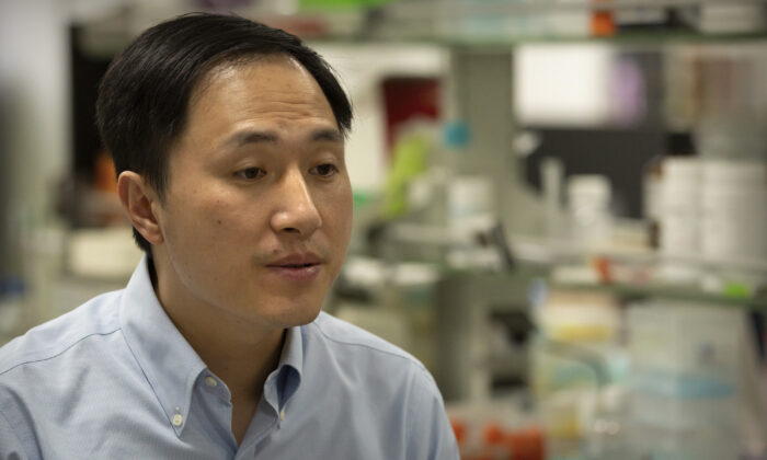Chinese scientist He Jiankui speaks during an interview at his laboratory in Shenzhen in southern China's Guangdong Province on Oct. 10, 2018. Chinese state media says the researcher He has been sentenced to three years for practicing medicine illegally. He Jiankui was also fined 3 million yuan. Two others were also sentenced on the same charge. (Mark Schiefelbein/AP Photo)