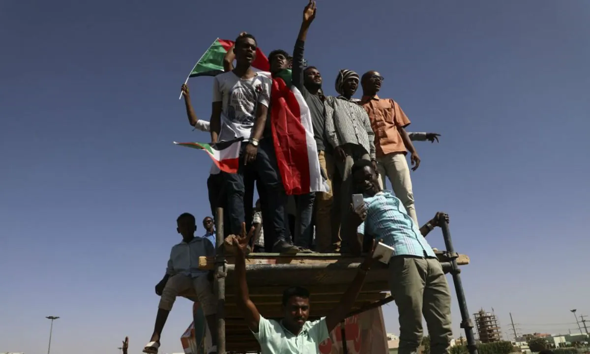 People gather as they celebrate first anniversary of mass protests that led to the ouster of former president and longtime autocrat Omar al-Bashir in Khartoum, Sudan, Nov. 19, 2019. (AP Photo)