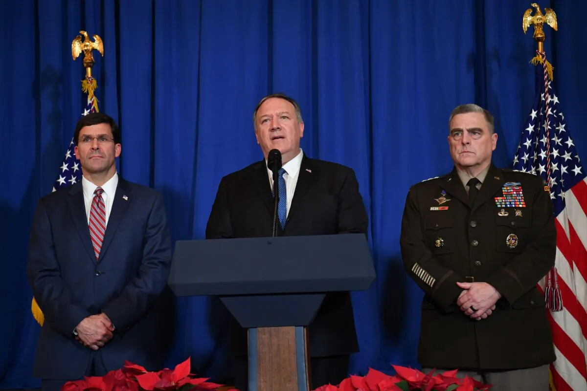 U.S. Secretary of State Mike Pompeo (C), U.S. Secretary of Defense Mark Esper (L) and Chairman of the Joint Chiefs of Staff US army general Mark A. Milley (R) speak on stage during a briefing on the past 72 hours events in Mar a Lago, Palm Beach, Florida, on Dec. 29, 2019. (Nicholas Kamm/AFP via Getty Images)