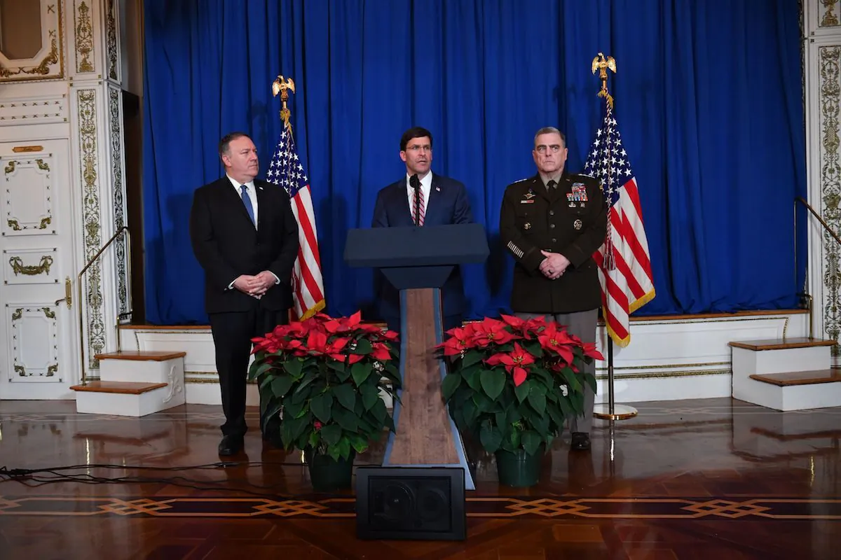 Secretary of State Mike Pompeo (L), Secretary of Defense Mark Esper (C) and Chairman of the Joint Chiefs of Staff US army general Mark A. Milley (R) speak on stage during a briefing on the past 72 hours events in Mar a Lago, Palm Beach, Fla., on Dec. 29, 2019. (Nicholas Kamm/AFP via Getty Images)