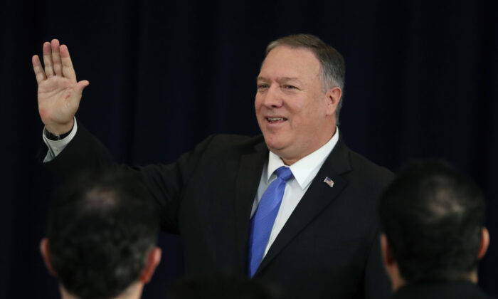 Secretary of State Mike Pompeo waves to guests after speaking about human rights in Iran at the State Department in Washington on Dec. 19, 2019. (Mark Wilson/Getty Images)