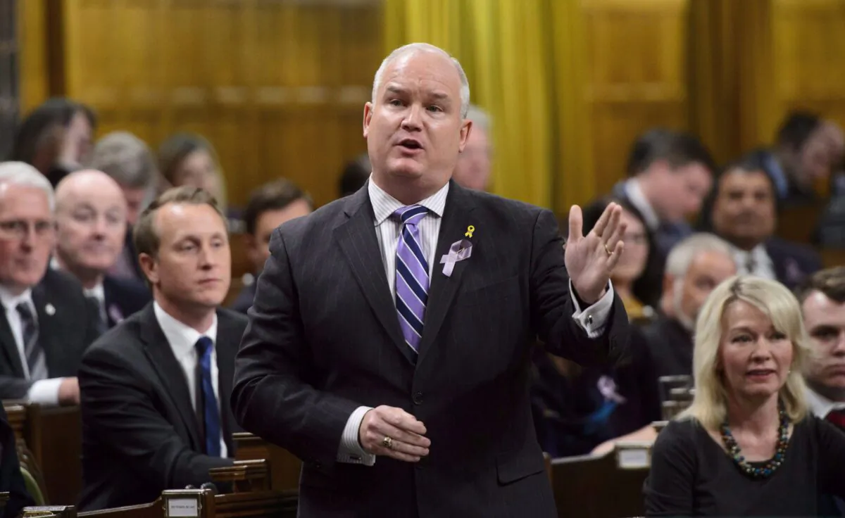 Conservative MP Erin O'Toole stands during question period in the House of Commons on Parliament Hill in Ottawa on March 26, 2018. O'Toole, a candidate in the last Tory leadership race, is working on a plan to make another bid for the party's top job. (The Canadian Press/Sean Kilpatrick)