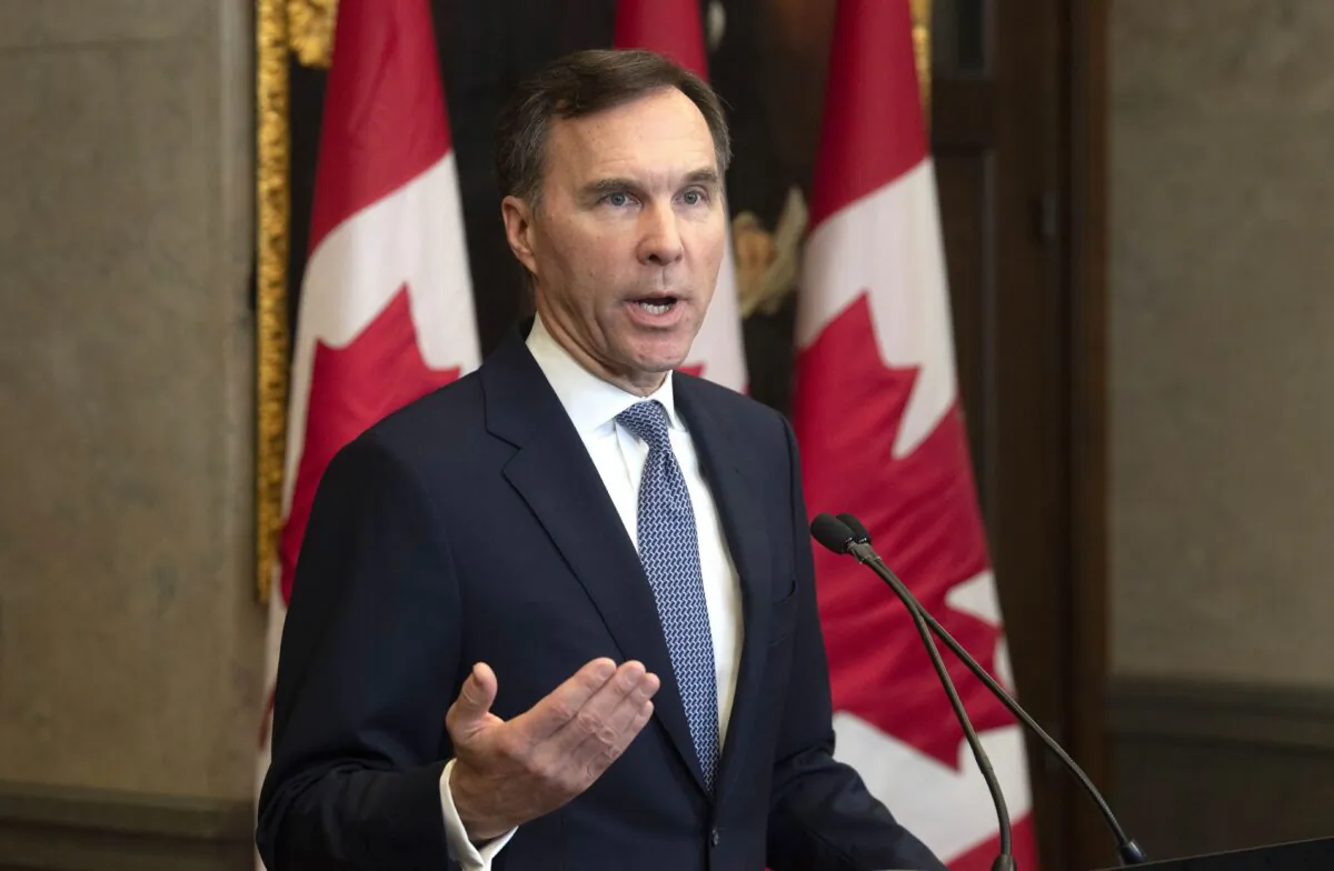 Finance Minister Bill Morneau provides a fiscal update in the foyer of West Block in Ottawa on Dec. 16, 2019. Parliamentary Budget Officer Yves Giroux was alarmed after the update projected a deficit $7 billion higher than the budget announced in March. (The Canadian Press/Adrian Wyld)