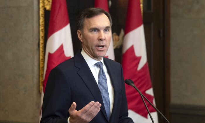 Finance Minister Bill Morneau provides a fiscal update in the foyer of West Block in Ottawa on Dec. 16, 2019. Parliamentary Budget Officer Yves Giroux was alarmed after the update projected a deficit $7 billion higher than the budget announced in March. (The Canadian Press/Adrian Wyld)