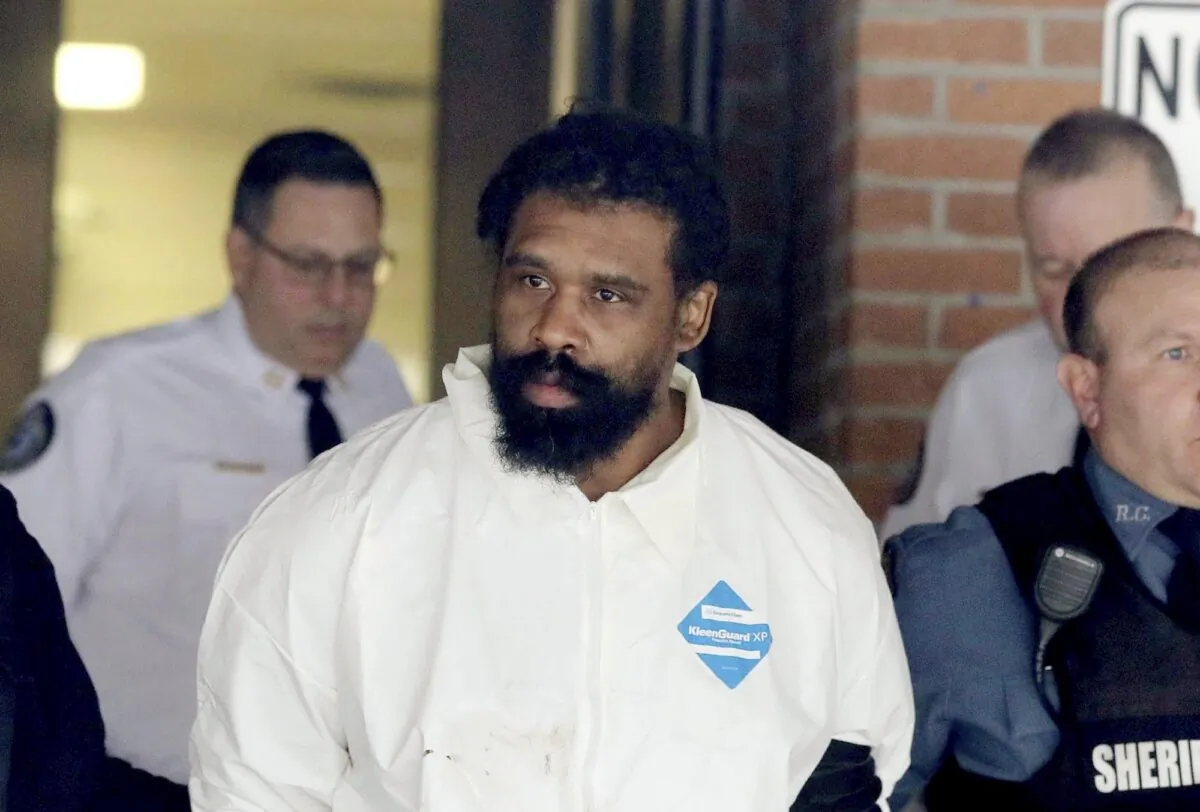 Grafton Thomas is led from Ramapo Town Hall in Ramapo, N.Y. following his arraignment on Dec. 29, 2019. (Seth Harrison/The Journal News via AP)