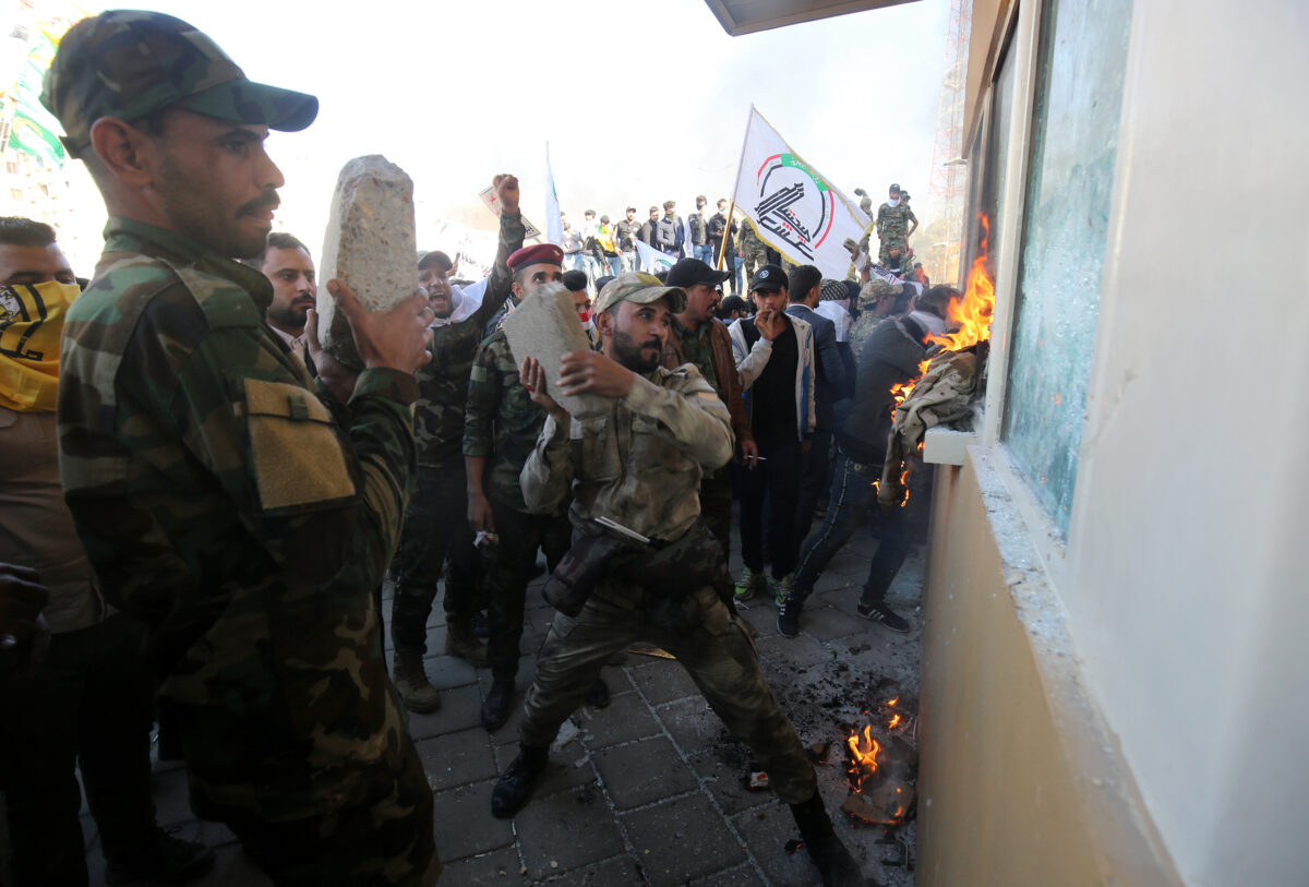 Members the Hashed al-Shaabi smash embassay