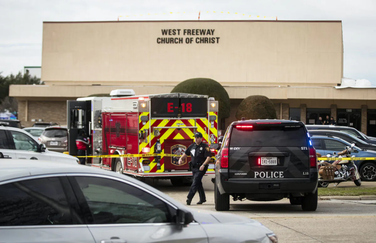 Police and fire department surround the scene of a shooting at West Freeway Church of Christ in White Settlement, Texas on Sunday, Dec. 29, 2019. (Yffy Yossifor/Star-Telegram via AP)