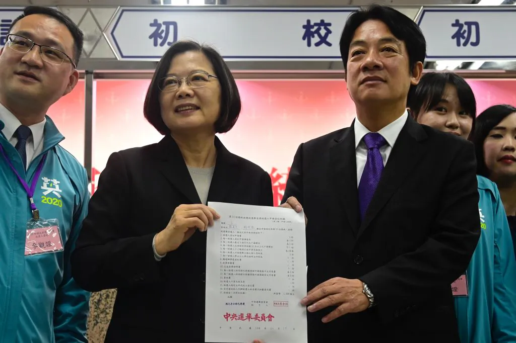Taiwan's President Tsai Ing-wen (2nd L) and former premier William Lai (R) display a certificate after registering as presidential and vice-presidential candidates for the upcoming election at the Central Elections Committee in Taipei on Nov. 19, 2019. (Sam Yeh/AFP via Getty Images)
