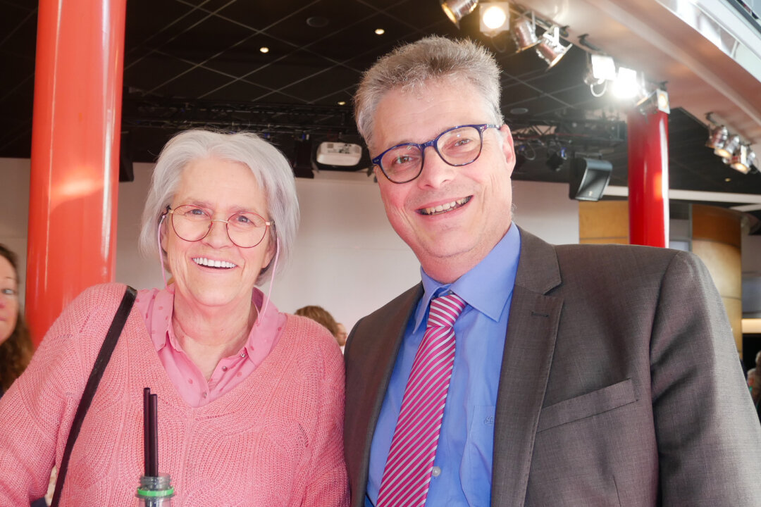 Jan Maarten van Rooij (R) and his companion enjoyed Shen Yun Performing Arts at the Chassé Theater in Breda, The Netherlands, on Jan. 29, 2020. (Sherry Dong/The Epoch Times)