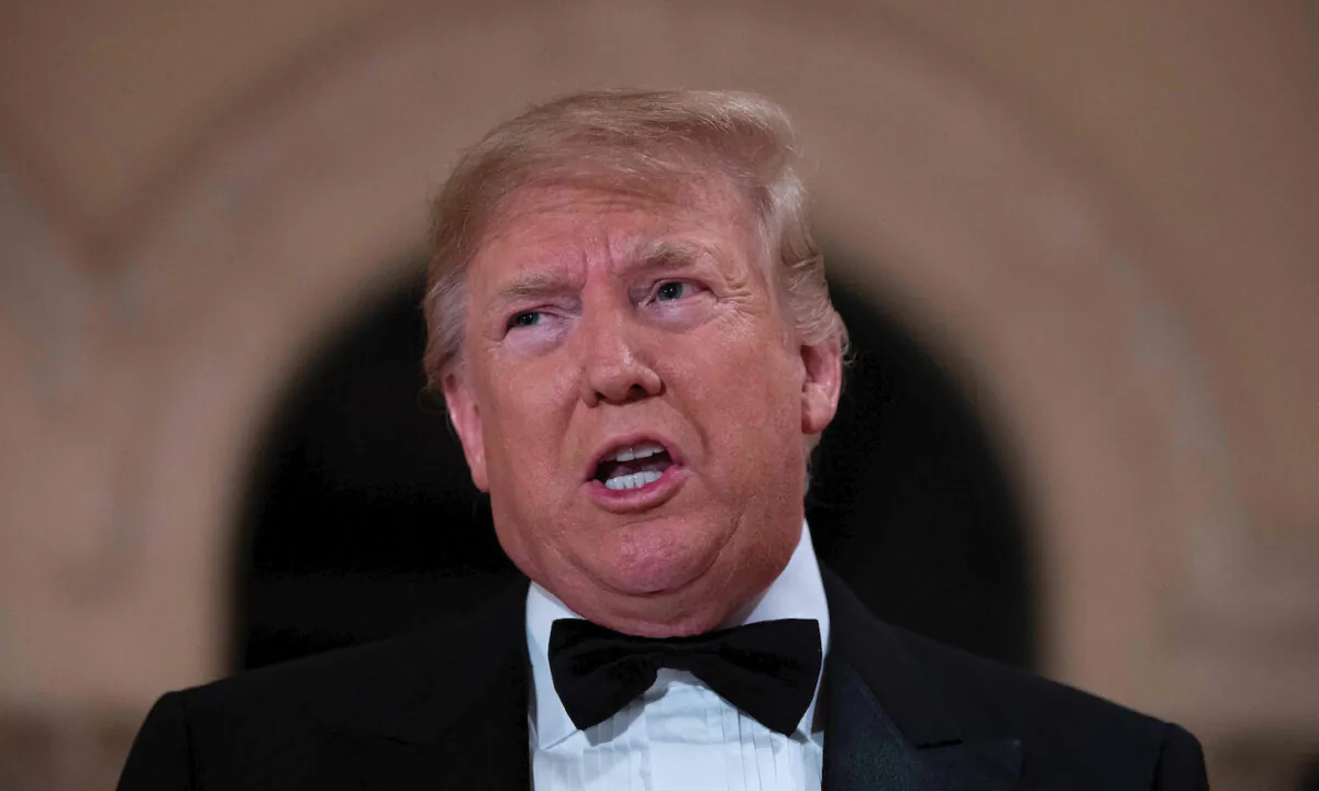 President Trump speaks to the press outside the grand ballroom as he arrives for a New Year's celebration at Mar-a-Lago in Palm Beach, Florida, on Dec. 31, 2019. (JIM WATSON/AFP via Getty Images)