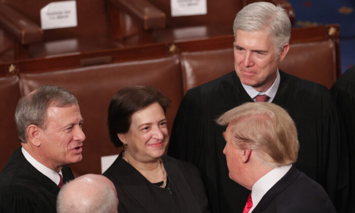 President Donald Trump greets Supreme Court Justices John Roberts, Elena Kagan, and Neil Gorsuch after the State of the Union Address in the chamber of the U.S. House of Representatives at the U.S. Capitol Building on Feb. 5, 2019. (Alex Wong/Getty Images)