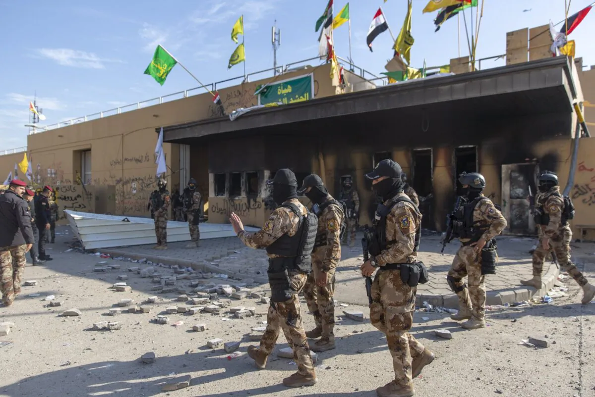 Iraqi army soldiers are deployed in front of the U.S. embassy, in Baghdad, Iraq, on Jan. 1, 2020. (Nasser Nasser/AP Photo)