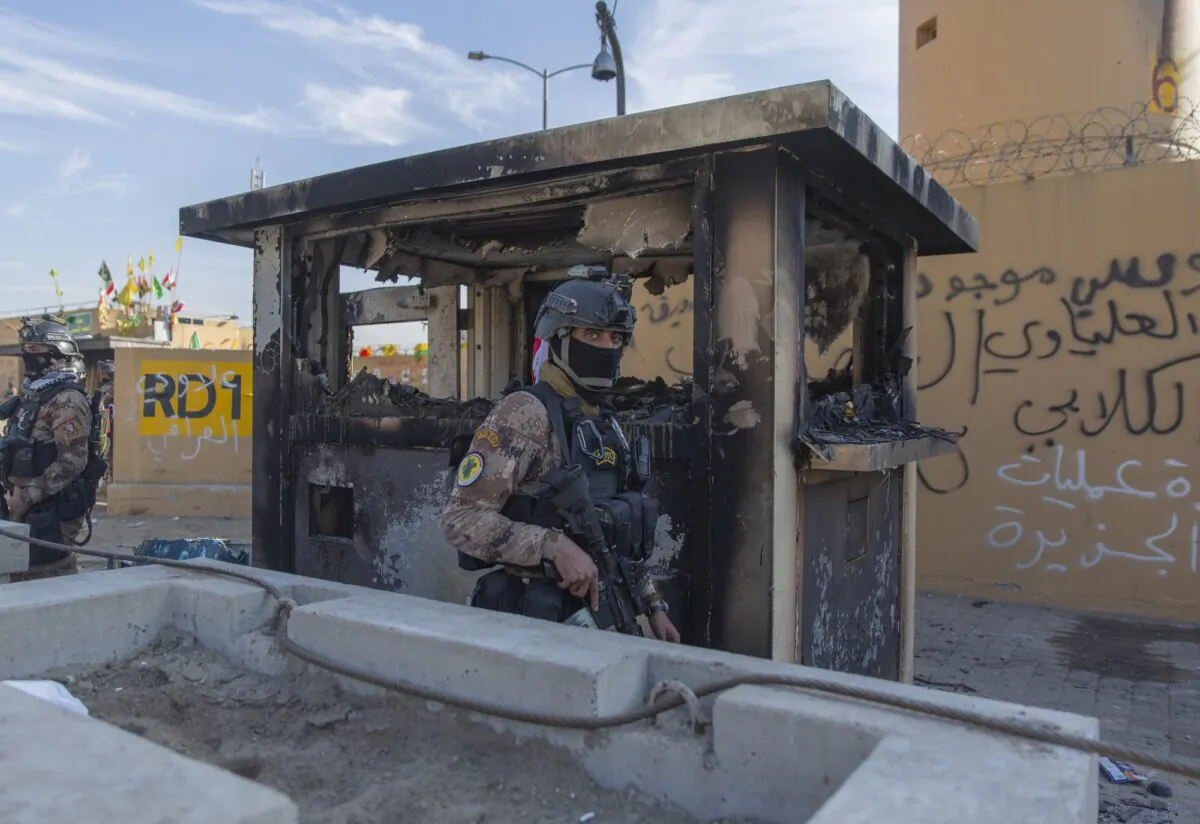 Iraqi army soldiers are deployed in front of the U.S. embassy, in Baghdad, Iraq, on Jan. 1, 2020. (Nasser Nasser/AP Photo)