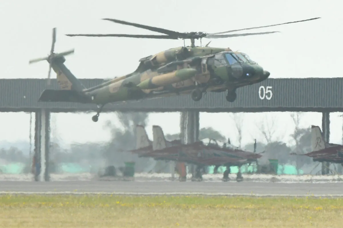 A military helicopter is seen landing at the RAAF Base in East Sale, Victoria, Australia, on Jan. 2, 2020. (AAP Image/James Ross)