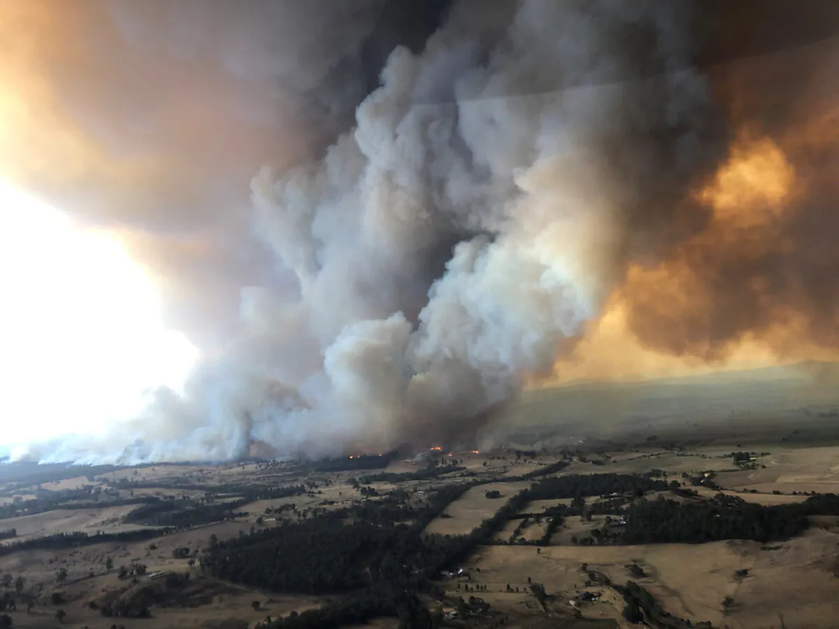 Smoke billows during bushfires in Buchan, a town in the east Gippsland region of Victoria, Australia, on Dec. 30, 2019. (Glen Morey/Social Media/via Reuters)