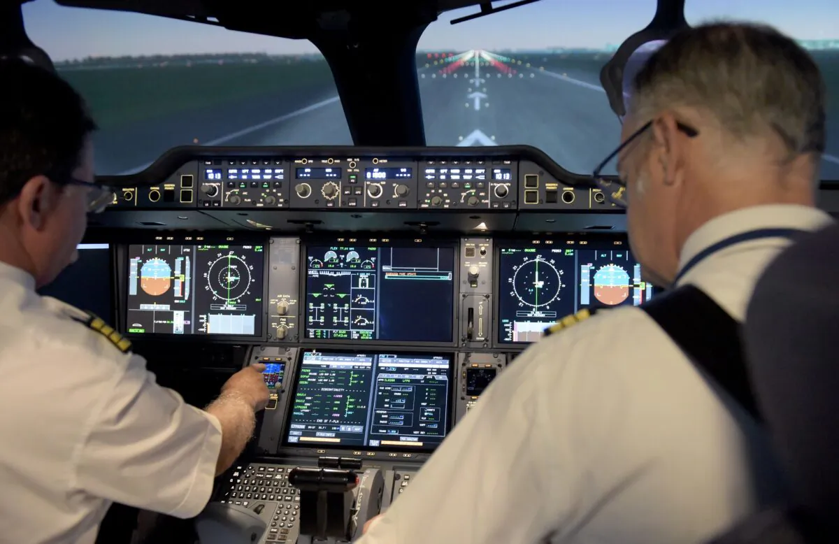 Air France pilots inside an Airbus A350 flight simulator at the company training centre near Roissy Charles de Gaulle airport, north-east of the French capital Paris on Sept. 16, 2019. (ERIC PIERMONT/AFP via Getty Images)