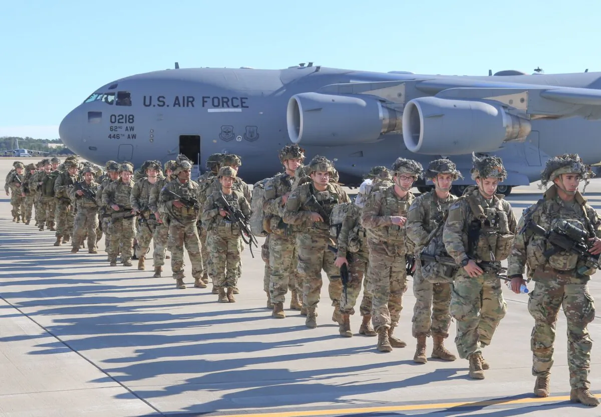 U.S. Army Paratroopers assigned to the 2nd Battalion, 504th Parachute Infantry Regiment, 1st Brigade Combat Team, 82nd Airborne Division, deploy from Pope Army Airfield, N.C., on Jan. 1, 2020. (Capt. Robyn Haake/US ARMY/AFP via Getty Images)