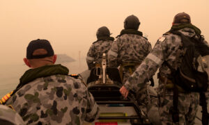 Australian Navy Begins Mass Evacuations as New Fire Threat Looms