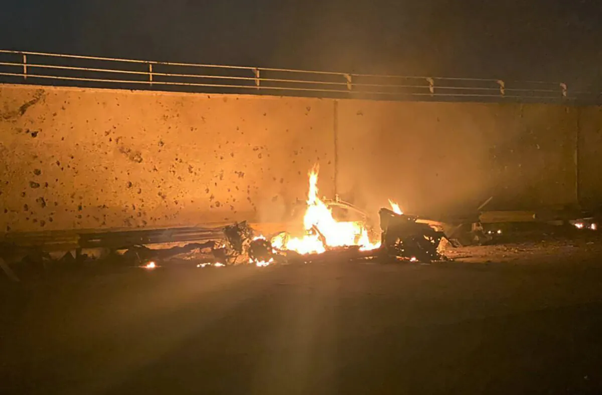 A burning vehicle at the Baghdad International Airport following an airstrike, in Baghdad, Iraq, early Jan. 3, 2020. (Iraqi Prime Minister Press Office via AP)