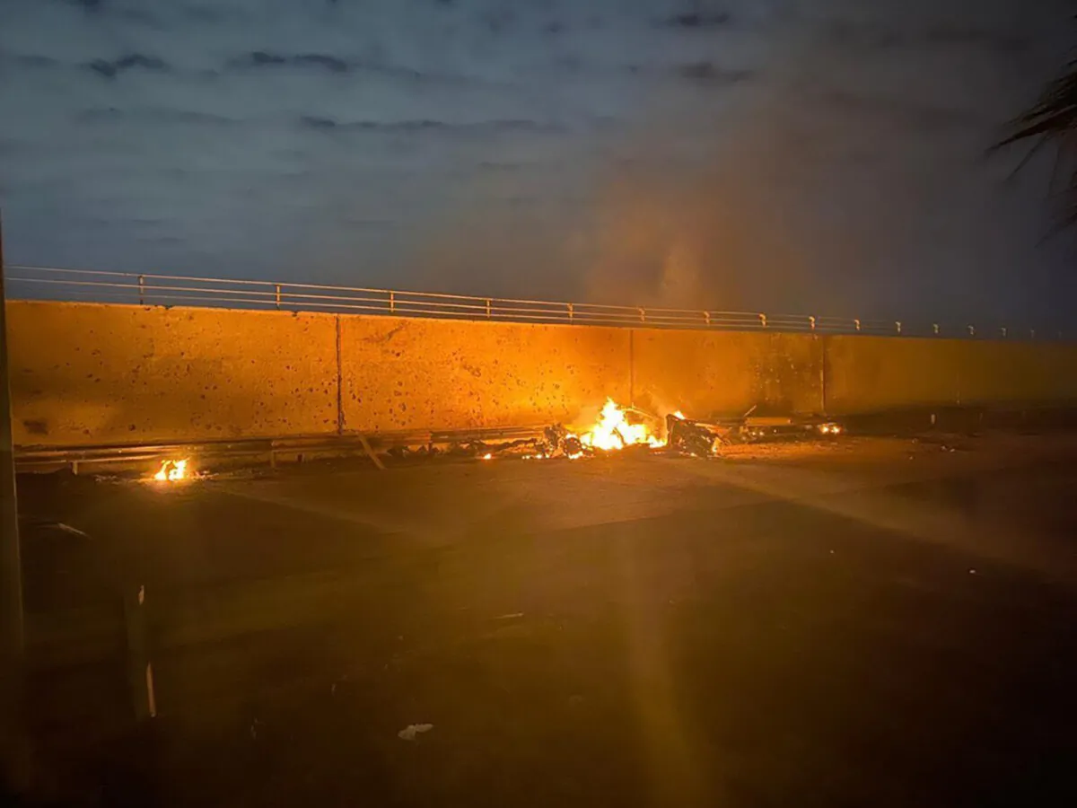 A burning vehicle at the Baghdad International Airport following an airstrike, in Baghdad, Iraq, early Friday, Jan. 3, 2020. (Iraqi Prime Minister Press Office via AP)