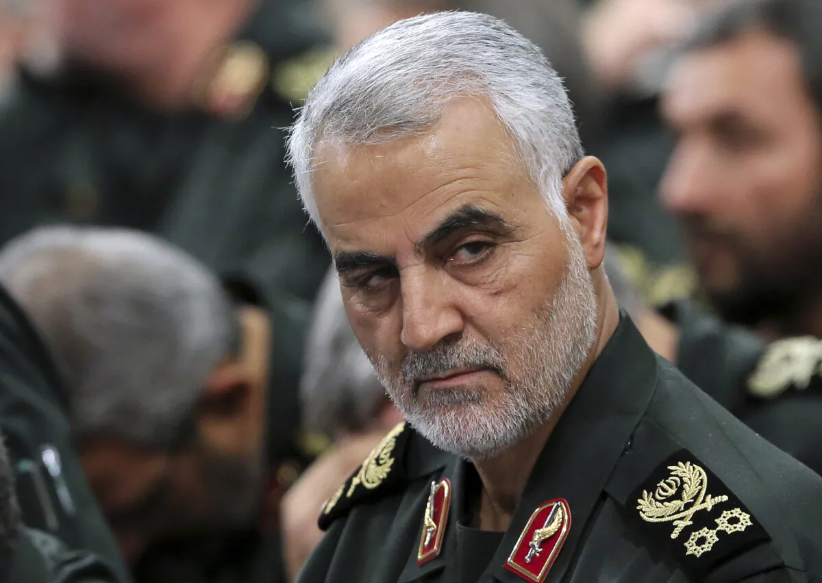 In this Sept. 18, 2016 photo released by an official website of the office of the Iranian supreme leader, Revolutionary Guard Gen. Qassem Soleimani, center, attends a meeting with Supreme Leader Ayatollah Ali Khamenei and Revolutionary Guard commanders in Tehran, Iran. A U.S. airstrike near Baghdad's airport on Friday Jan. 3, 2020 killed Gen. Qassem Soleimani, the head of Iran's elite Quds Force. Soleimani was considered the architect of Iran's policy in Syria. (Office of the Iranian Supreme Leader via AP, File)