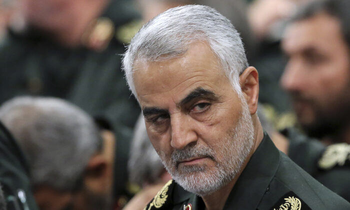 In this Sept. 18, 2016 photo released by an official website of the office of the Iranian supreme leader, Revolutionary Guard Gen. Qassem Soleimani, center, attends a meeting with Supreme Leader Ayatollah Ali Khamenei and Revolutionary Guard commanders in Tehran, Iran. A U.S. airstrike near Baghdad's airport on Friday Jan. 3, 2020 killed Gen. Qassem Soleimani, the head of Iran's elite Quds Force. Soleimani was considered the architect of Iran's policy in Syria. (Office of the Iranian Supreme Leader via AP, File)