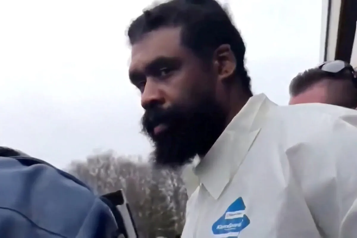 Grafton Thomas, a suspect in an attack at a Hasidic rabbi's home, walks from Ramapo jail to be arraigned on five counts of attempted murder in a state court in Ramapo, New York, NY on Dec. 29, 2019. (WNBC via Reuters)