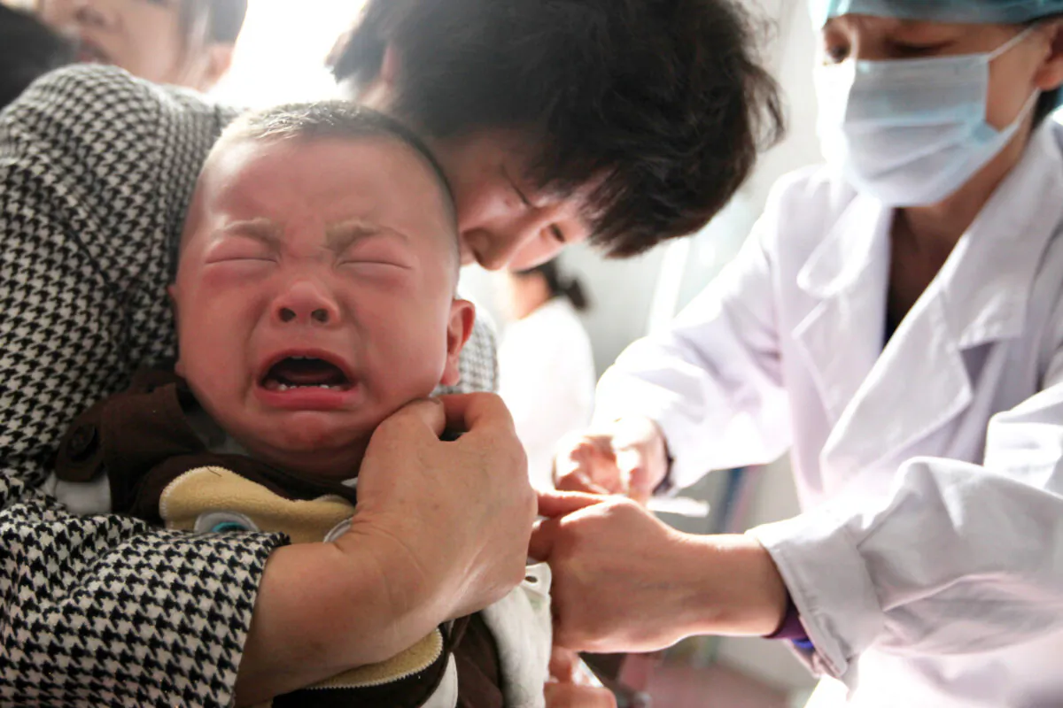 A child receives a vaccination shot at a hospital in Huaibei in China's eastern Anhui province on July 26, 2018. (-/AFP via Getty Images)