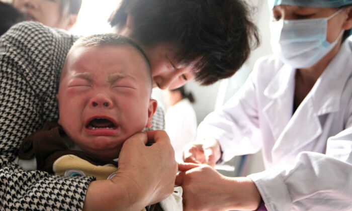 A child receives a vaccination shot at a hospital in Huaibei in China's eastern Anhui province on July 26, 2018. (-/AFP via Getty Images)