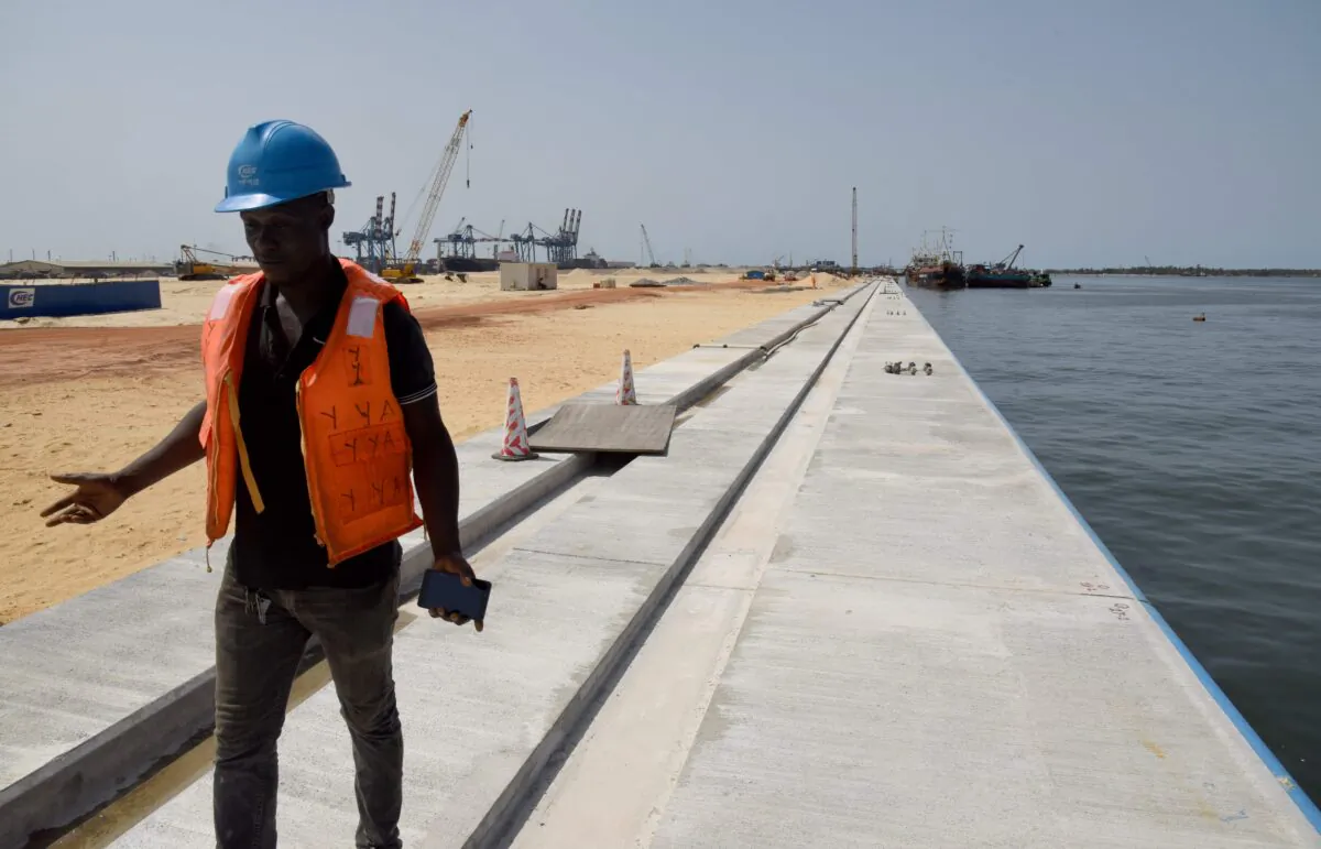 A technician works on the construction site of a new container terminal at the port of Abidjan on March 27, 2019. The modernization of Abidjan Port which started in 2012 are led by Chinese engineers and workers whose country finances up to 1,100 billion FCFA (1.67 billion euros). (Issouf Sanogo /AFP via Getty Images)